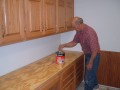 2005-04-30 Lloyd Oberholtzer installing cabinets * 1600 x 1200 * (611KB)